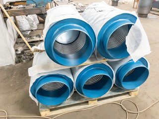 Blue flange expansion joints on the ground production area