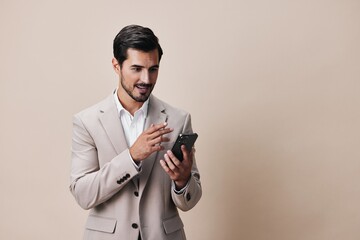 man smile business hold smartphone young suit phone portrait happy call