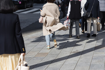 crowd of people walking in the city