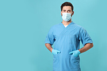 Nurse with medical mask on light blue background, space for text