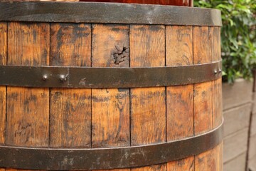 Traditional wooden barrel outdoors, closeup. Wine making