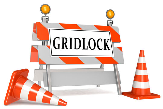 Gridlock sign on barricade and traffic cones