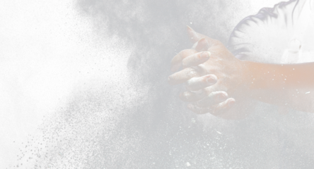 Chef prepare white flour dust for cooking bakery food. Elderly man Chef clap hand, white flour dust explode fly in air. Flour stop motion in air with freeze high speed shutter, black background