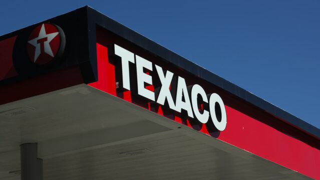 Honolulu, HI - January 10, 2023 : Chevron Corporation owned Texaco gas station sign with name and logo