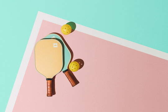 Pickleball Paddles and Balls on Court