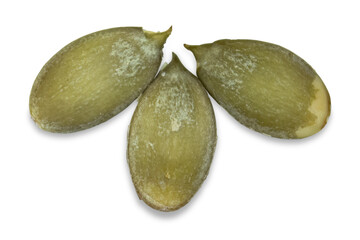 Three peeled pumpkin seeds close-up isolated on a transparent background.