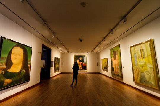 Bogota, Colombia - January 2, 2023: Female visitor looks at Botero's version of Da Vinci's Mona Lisa