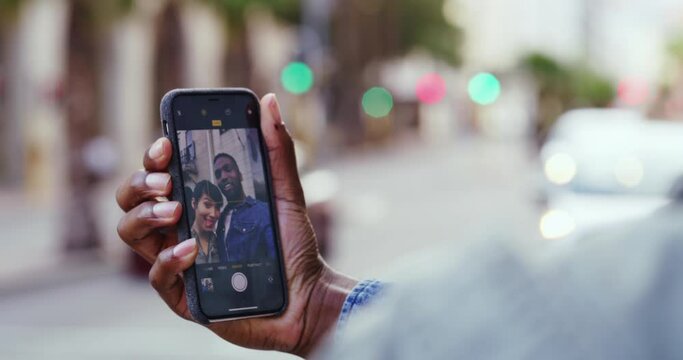 Hand, phone screen and selfie with couple in city, technology and social media post with mockup space. Mobile app, people smile in picture and urban with photography, bonding outdoor with smartphone