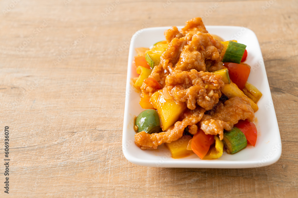 Sticker stir fried sweet and sour sauce with pork