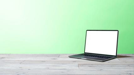 緑の壁とノートパソコン