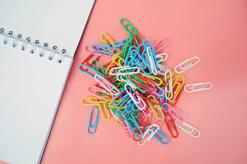Paperclips on white background, National Paperclip Day illustration.