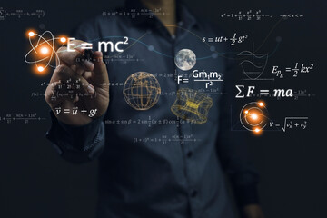 Scientists use a pen to write physics or mathematical equations to solve problems or to teach. Albert Einstein's equation energy mass speed of light Emc2. Newton's Law of Motion Force Fma. - obrazy, fototapety, plakaty