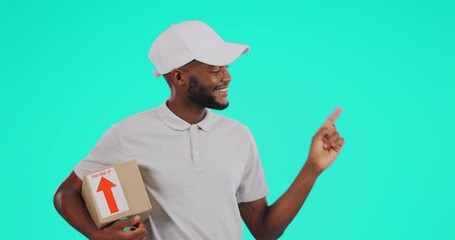 Portrait, shipping and pointing with a black man courier in studio on a blue background holding a box. Logistics, ecommerce and package with a happy male postal worker showing a delivery safety guide
