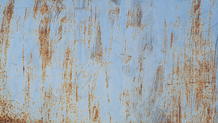 Old rusty plaque on blue background