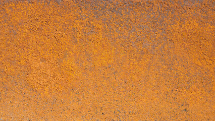 Old rusty plaque on orange background