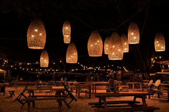 Restaurant With Tables And Chairs In The Garden At Night Outdoor