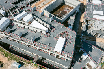 construction site of a reinforced concrete monolithic building. work stopped. aerial overhead view.