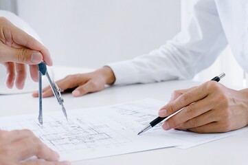 Colleagues interior designer Corporate Achievement Planning Design on blueprint Teamwork Concept...