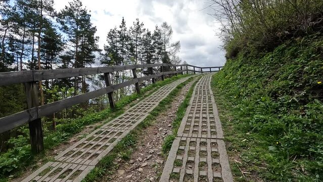 The nature road to the Castle ruins of Rytro village in southern Poland, cloudy winter sky
