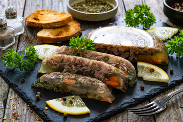 Turkey meat in jelly wooden table
