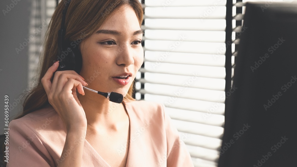 Aufkleber competent female operator working on computer and while talking with clients. concept relevant to bo