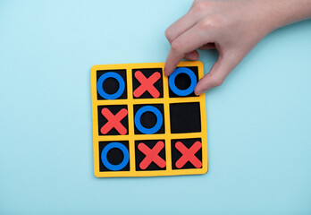 A game of tic tac toe. Concept XO Win Challenge. Developmental game for children. Flat lay, top view. Business marketing strategy planning concept.