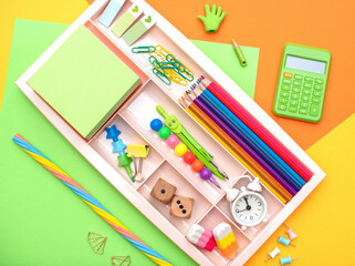 Stylish colored stationery.  Workplace. Organization of a drawer at the workplace. Storage and order of office supplies. Concept back to school.