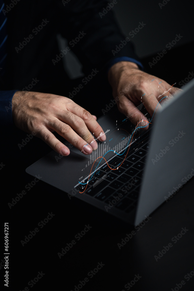 Fototapete businessman working with holograms showing business graphs and various information in work, using te