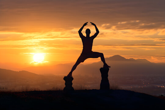 Exercising yoga man at dawn