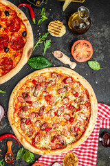 Set Pizza background. various kinds of Italian pizza on a dark background, Fast food lunch, vertical image. top view. place for text