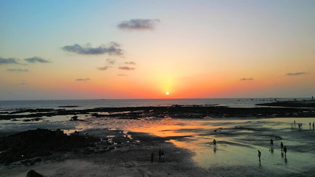 football playing in beside the sea in evening in gorai mumbai