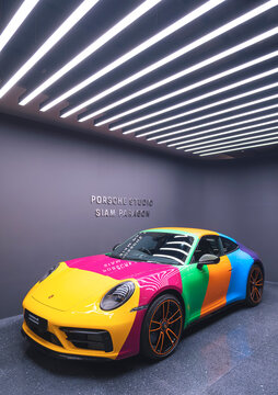 Bangkok, Thailand - May 26,2023 : Colorful Porsche 911 limited edition sports car from Porsche Exclusive Manufaktur showing in Porsche studio room at Siam Paragon in vertical frame