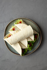 Homemade Avocado Tuna Wraps on a Plate, top view. Flat lay, overhead, from above.