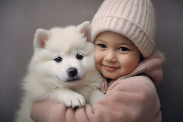 Young girl with cute fluffy spitz puppy studio shot portrait