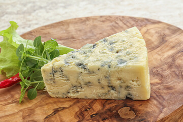 Blue cheese piece over board