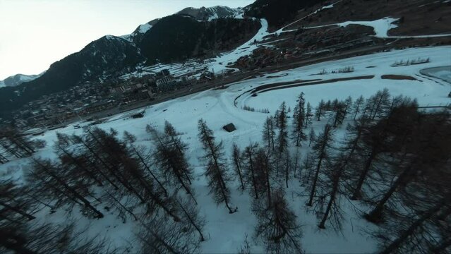 winter ski snowboard Mont Genevre wintersport destination, France, amazing establishment drone aerial shot, fast FPV action, great weather and fresh powder snow on the piste. 