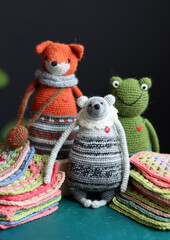 Crochet amigurumi toys made of organic yarn. Eco friendly gift ideas concept. Stuffed animals close up photo.  