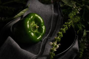 green pepper on black background
