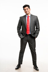 Young indian businessman in classic suit giving expression.