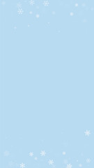 Magic falling snow christmas background. Subtle flying snow flakes and stars on light blue winter backdrop. Magic falling snow holiday scenery.   Vertical vector illustration.