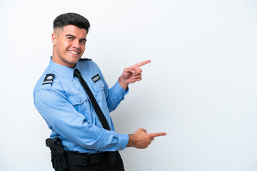 Young police caucasian man isolated on white background pointing finger to the side and presenting...