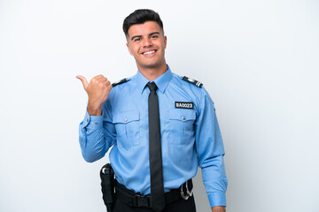 Young police caucasian man isolated on white background pointing to the side to present a product
