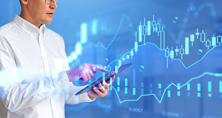 Man with tablet working with graph