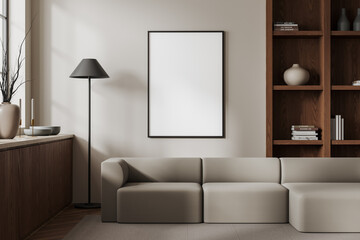 White living room with sofa, bookcase and blank poster