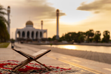 Islamic concept - The Holy Al Quran with written Arabic calligraphy meaning of Al Quran and rosary...