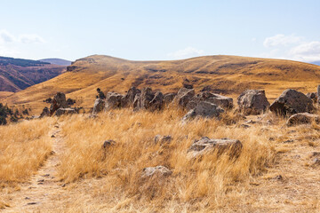 Standing stones in Zorats-Karer or Karahunj. Ancient megalithic complex, Syunik region of Armenia.