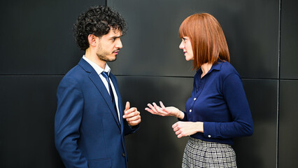 Business partners discussing together outdoor in a modern urban setting