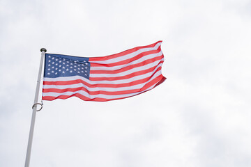 American flag waving in wind. Symbol of the United States of America. 