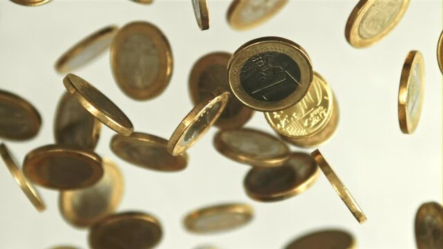 Coins fly up and fall down. Filmed is slow motion 1000 fps. High quality FullHD footage