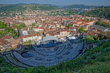 VIENNE, FRANCE, May 26, 2023 : General view of the city center, roman theater and hills surrounding the Rhone river valley.